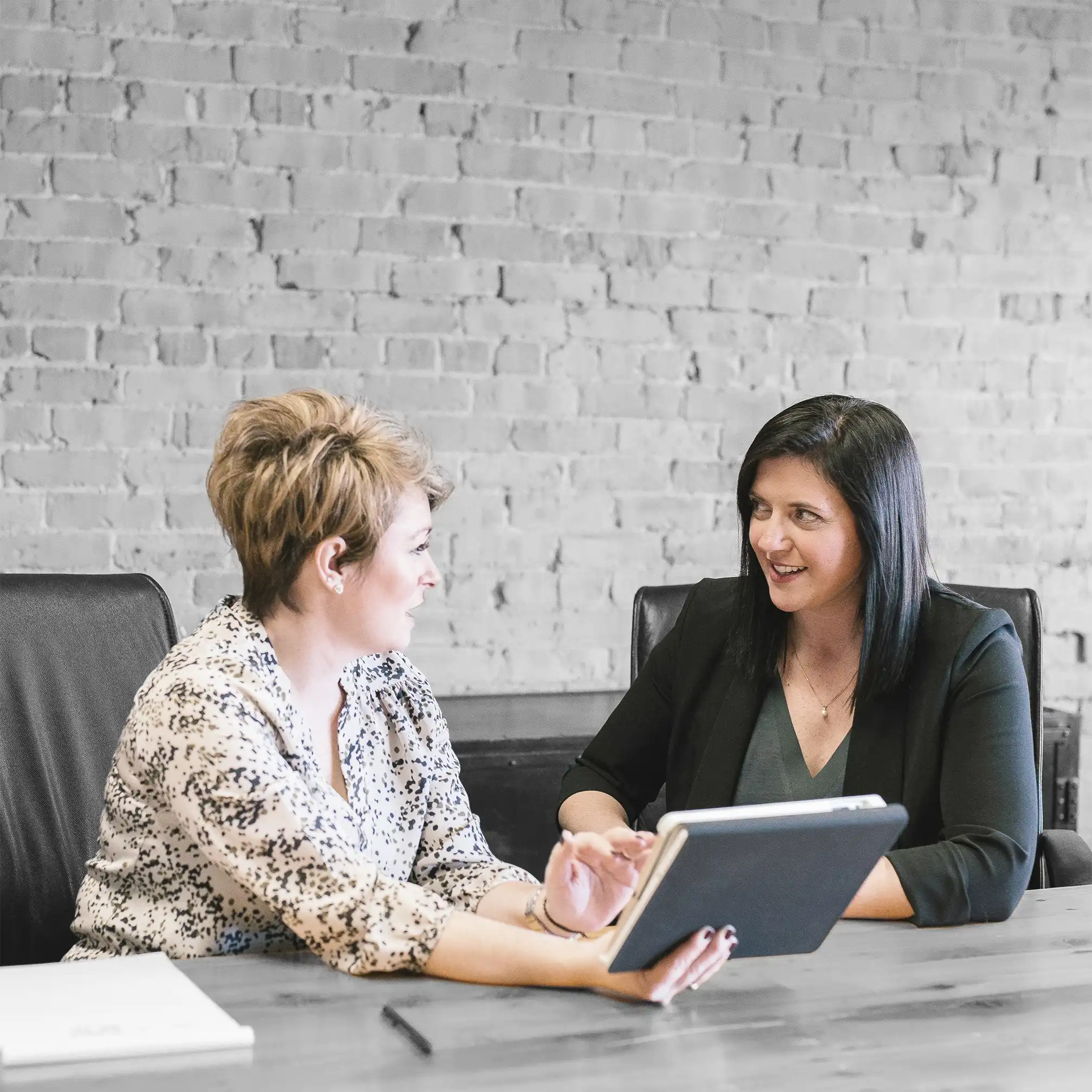 Two female business woman having a meeting